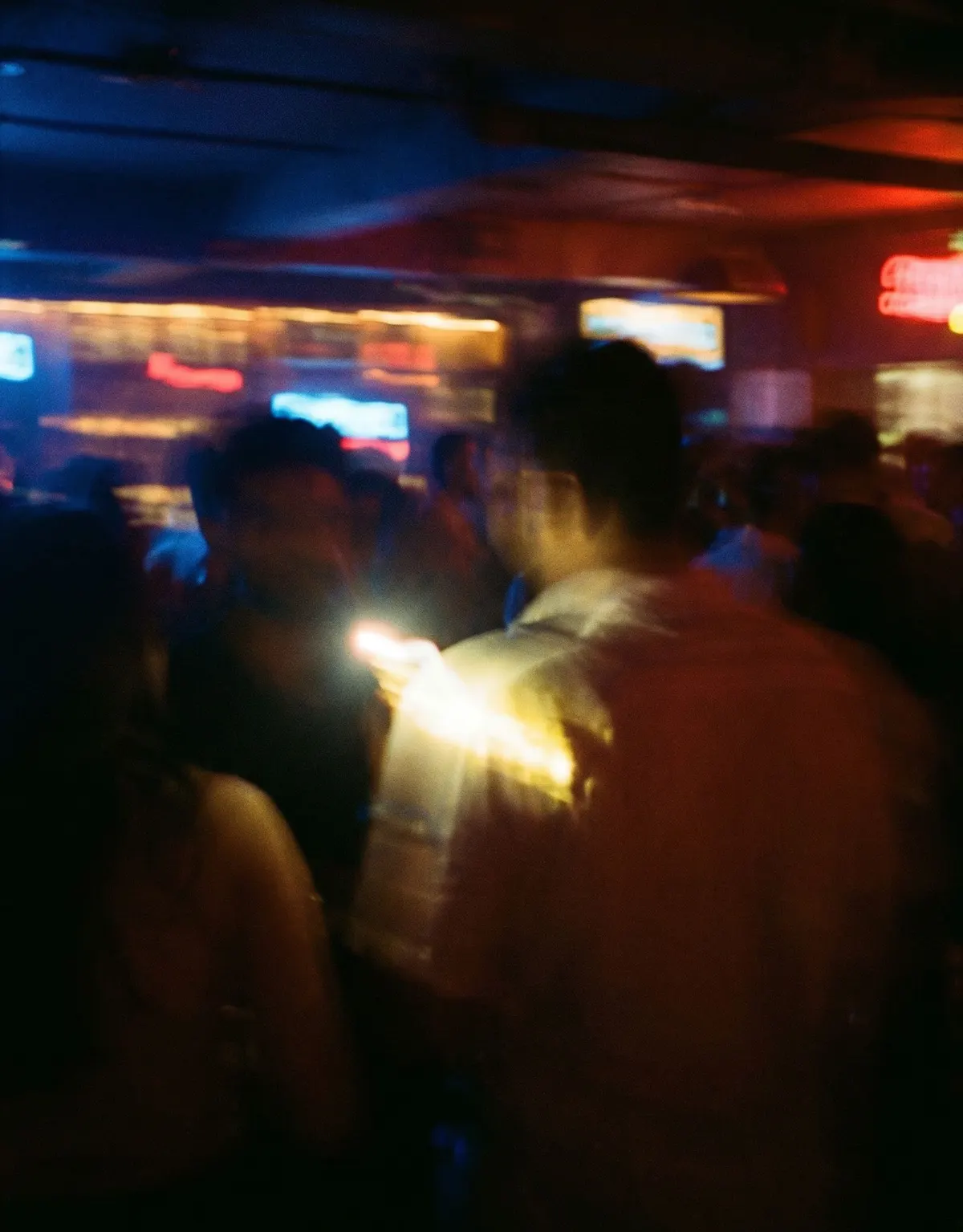 Motion-blurred crowd in a bar